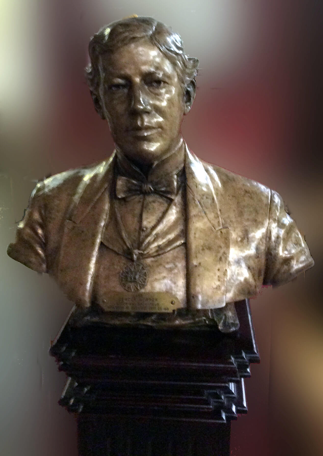 Bronze bust of gentleman wearing bow tie