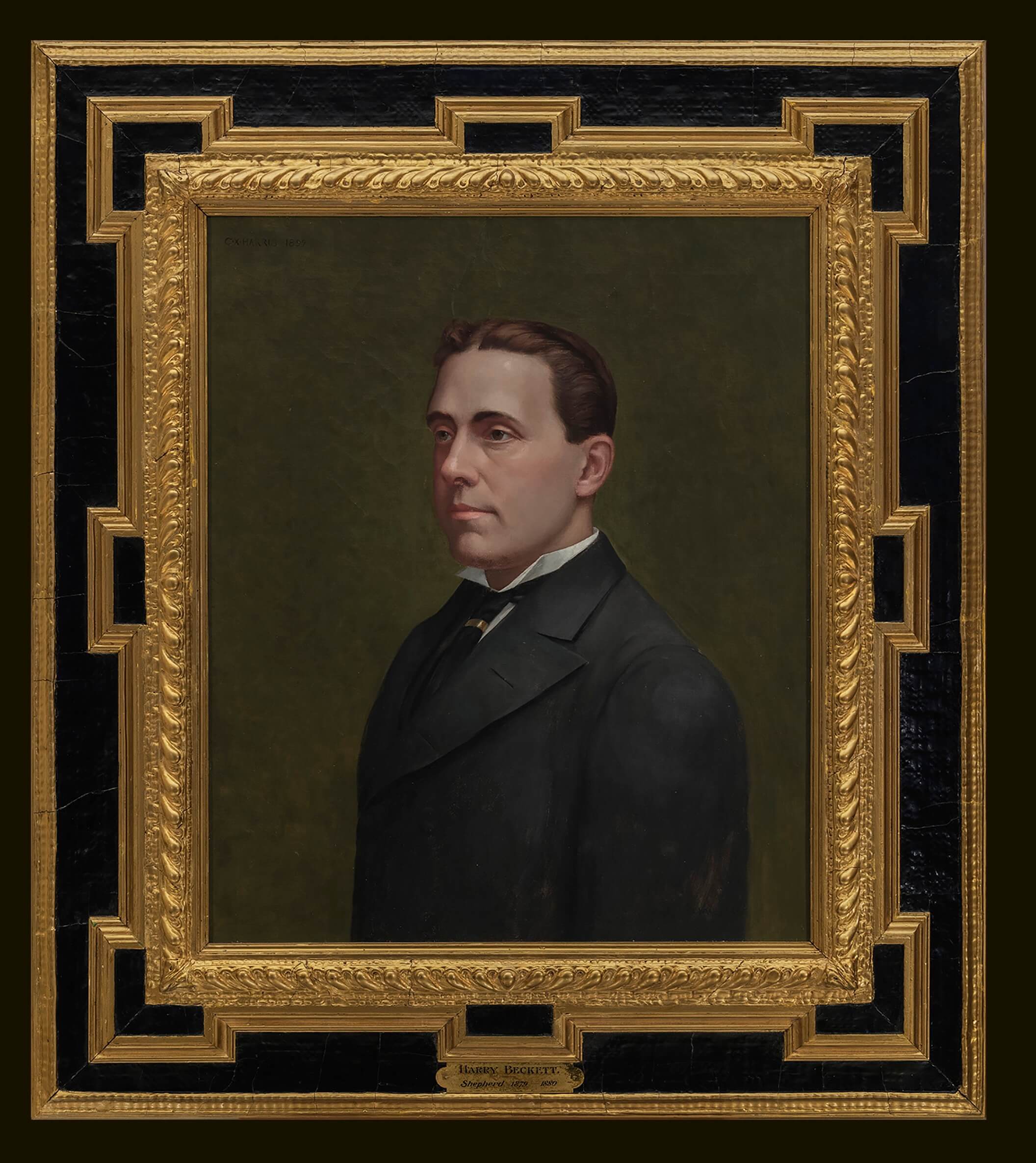 Formal portrait of man in ornate frame
