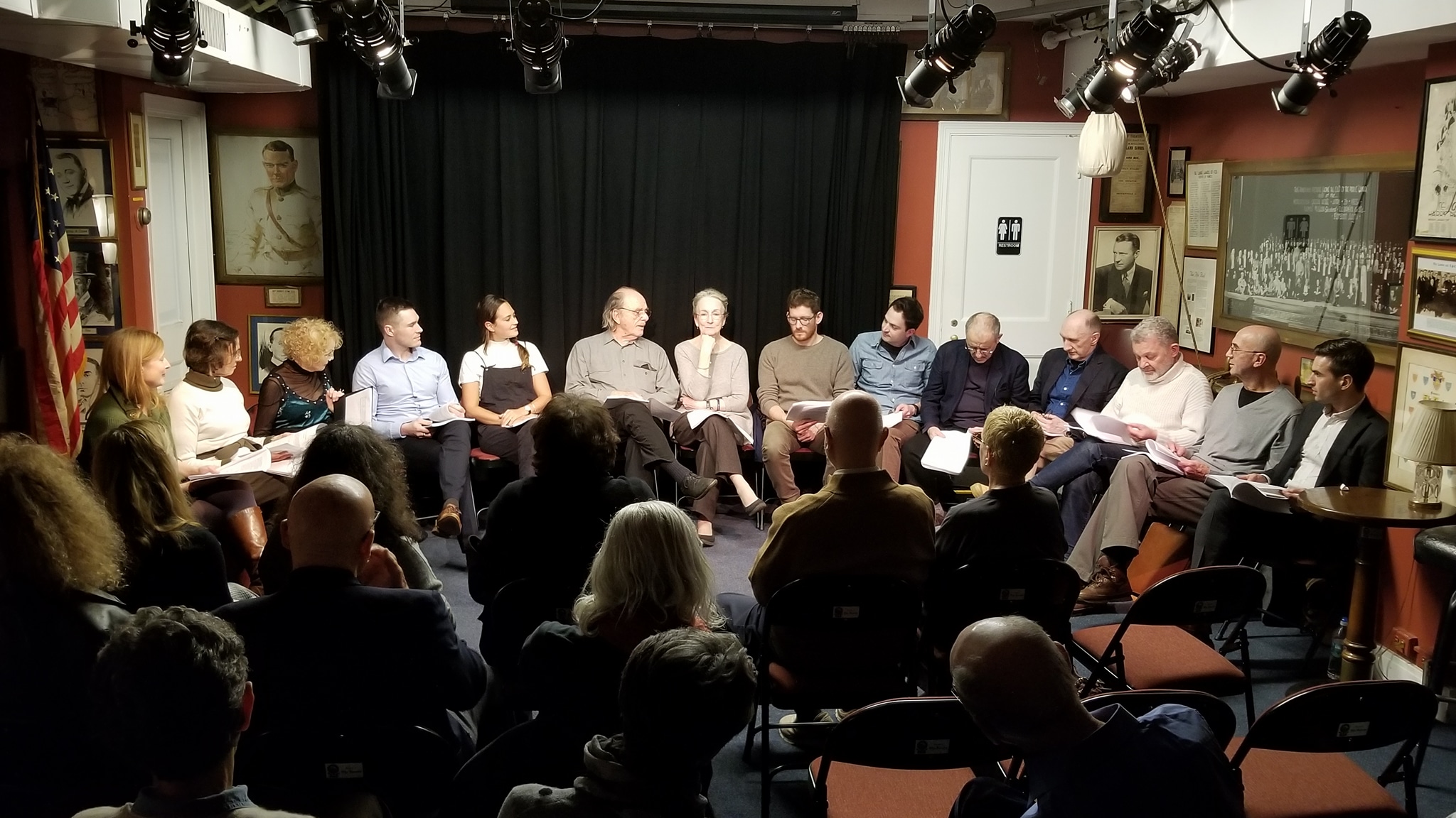 Panel discussion in intimate theater with audience