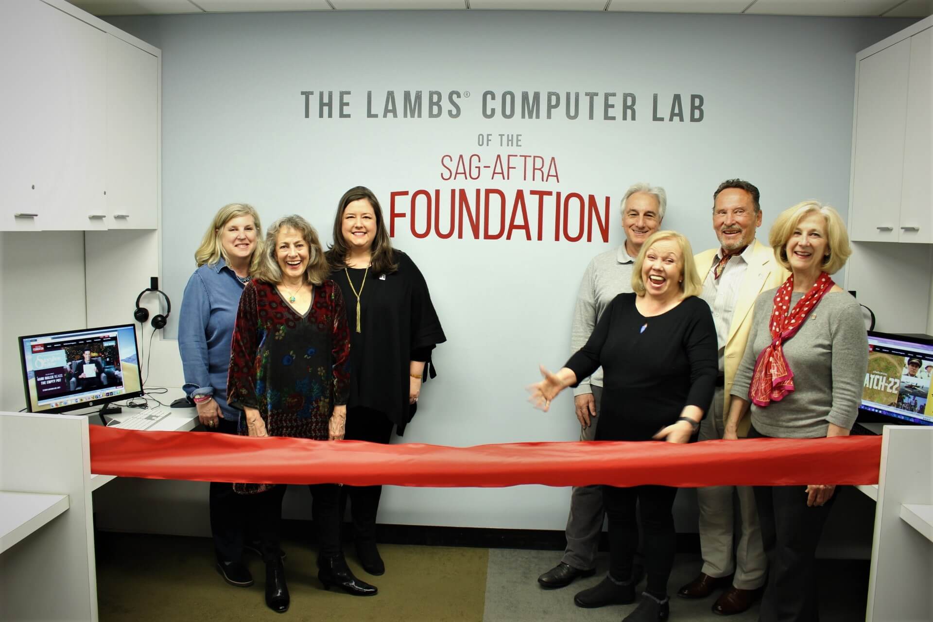 Group at ribbon-cutting for computer lab.